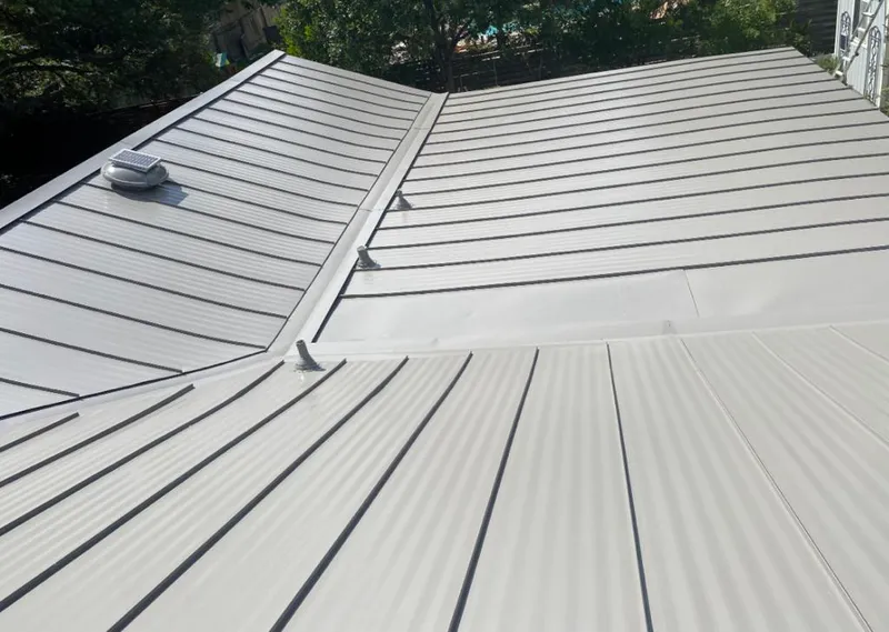 Solar attic fan installed on a metal roof for Roof Ventilation in Moultrie